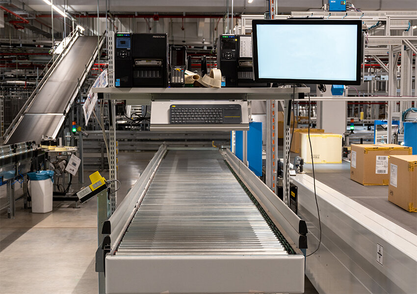 Treston customised workbenches above conveyer 1